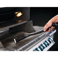 Napoleon Industrial Stainless Steel Grill Brush -BBQGrills Shop Low Res JPG 62052 IndustrialSSCleaningBrush WithScraper InUse Hook