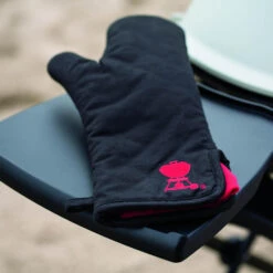 Weber Grills Black With Red Kettle Cotton Grill Glove With Extra Long Cuff -BBQGrills Shop Weber Black with red kettle cotton grill glove resting on side shelf
